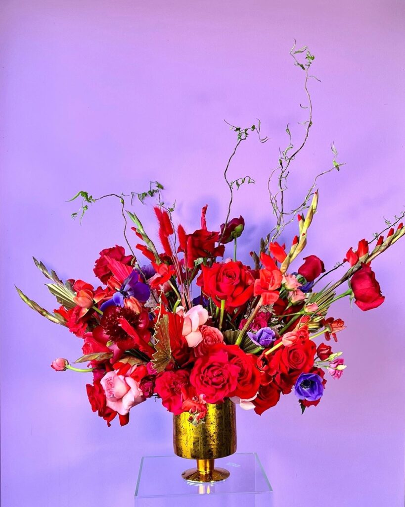 Flower arrangement with red and pink roses