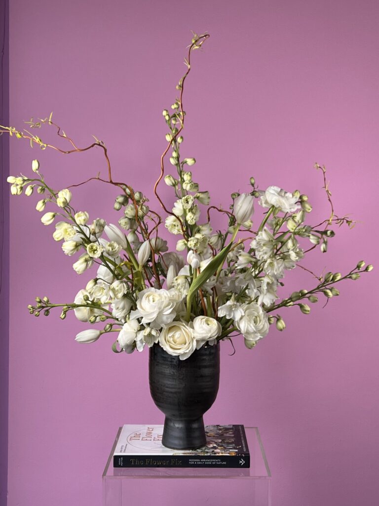 Flower arrangement with various white flowers